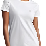 Bright white women's Ashdown t-shirt by Underscored with small Earth logo on left chest, worn by a female model.